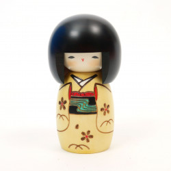 Japanese kokeshi doll with young girl motif in yellow, KI OSANAGO